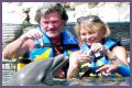 Goldie Hawn Rocks a Red Swimsuit at Age 67, Feeds Dolphins With Kurt Russell